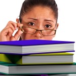 Lady Looking At Books Showing Education